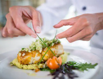 Chef fixing a plate of food