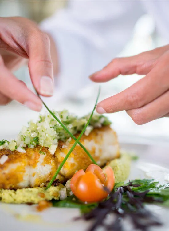Chef fixing a plate of food