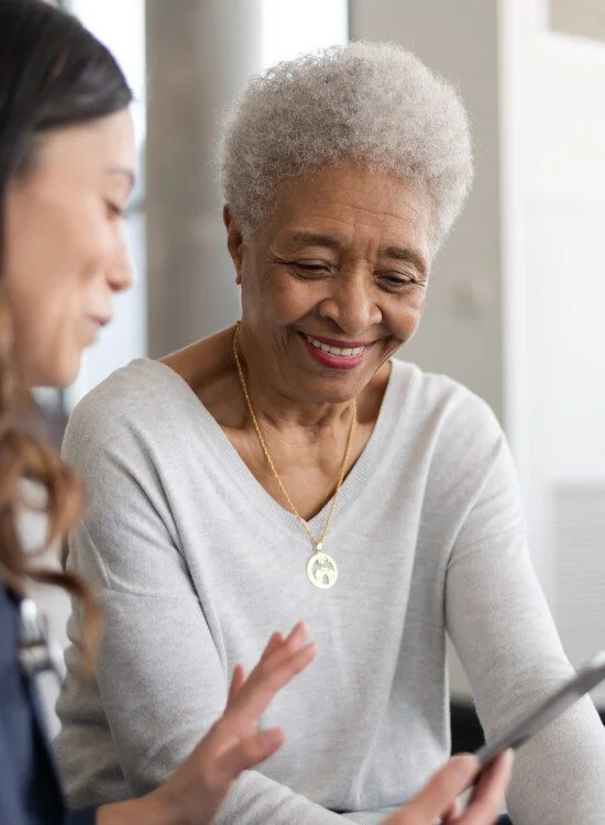Young doctor with elderly patient