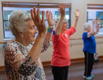Women with arms up doing yoga