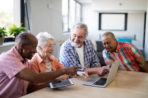 group of seniors socializing in their assisted living community