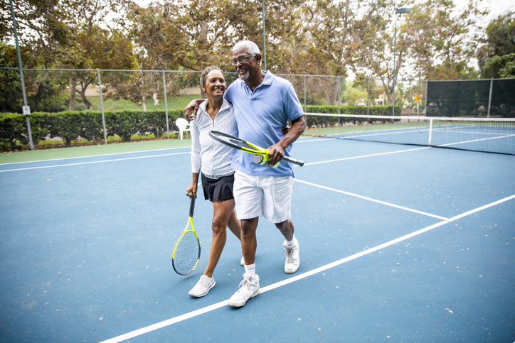 Senior Black Couple Walking Off the Tennis Court