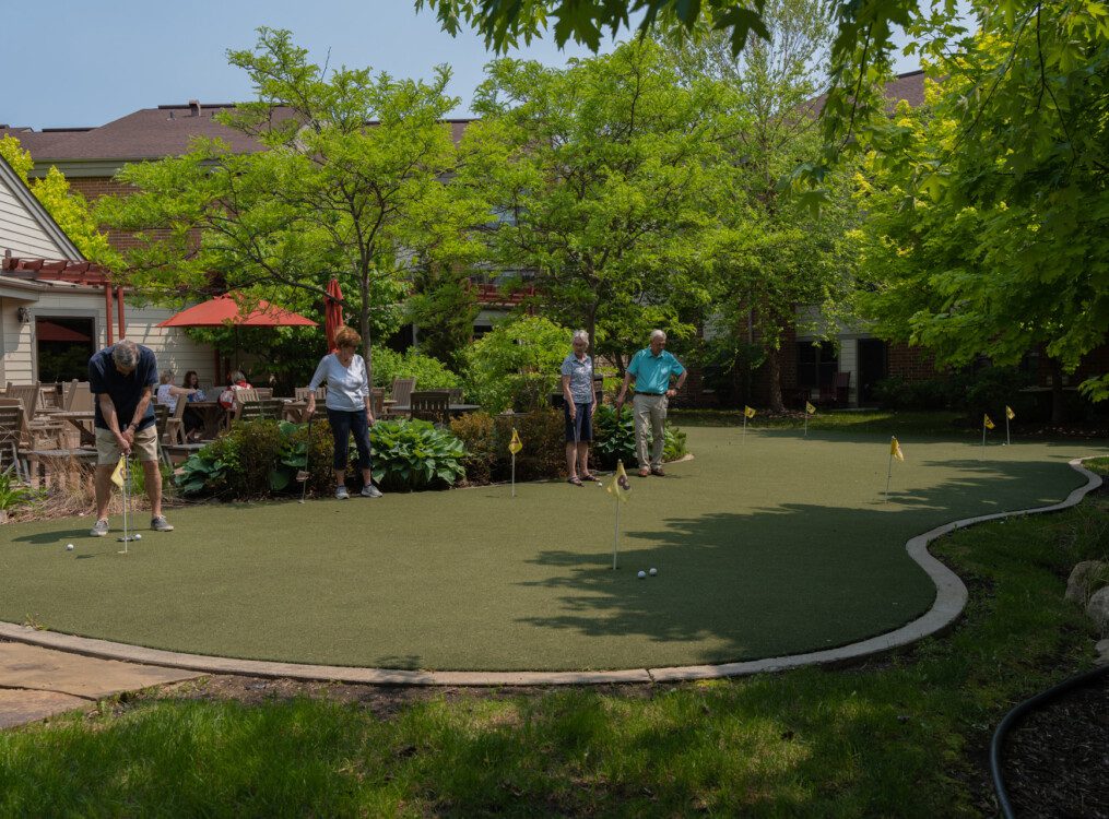 people on putting green