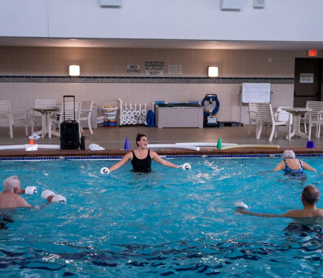 seniors doing exercises in the pool