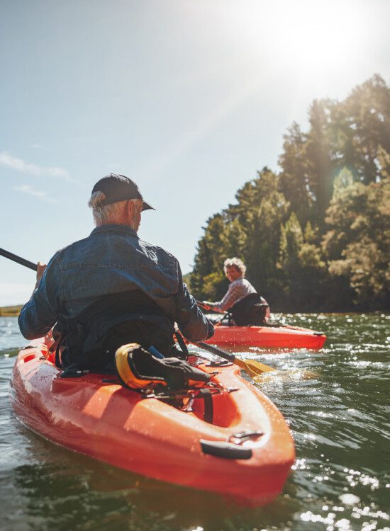 man in kayak on lake