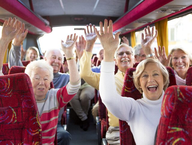 Group of seniors traveling on a tour bus