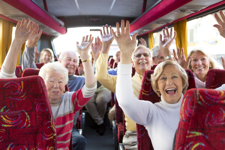 Group of seniors traveling on a tour bus
